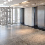 Full height turnstile elevator bank installation