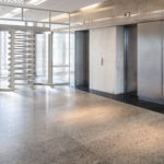 Full height turnstile elevator bank installation